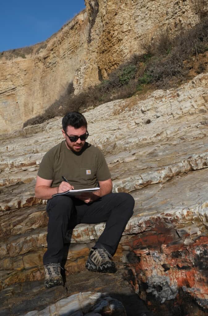 Geologist and petroleum engineer, Sam Klarin, working in the field